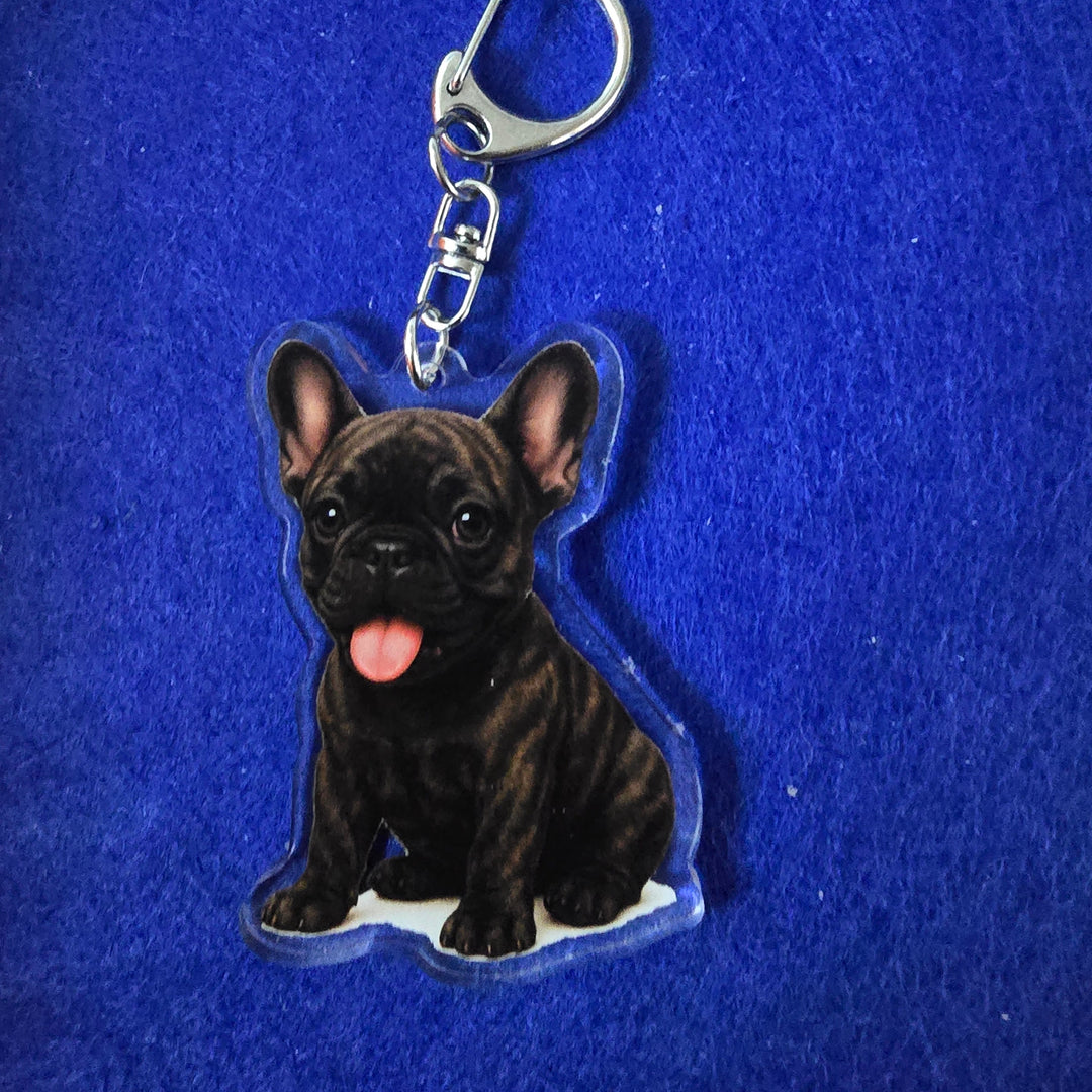French Bulldog Brindle Watercolor Style - Acrylic Keychains on a blue background