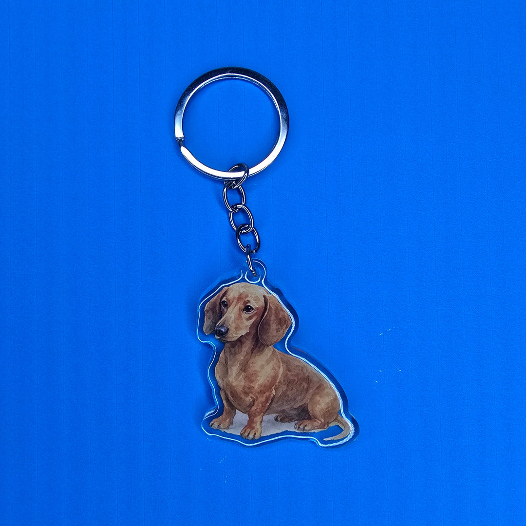 Keychain with a dog design on a blue background