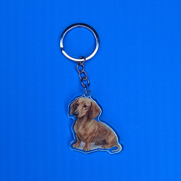 Keychain with a dog design on a blue background
