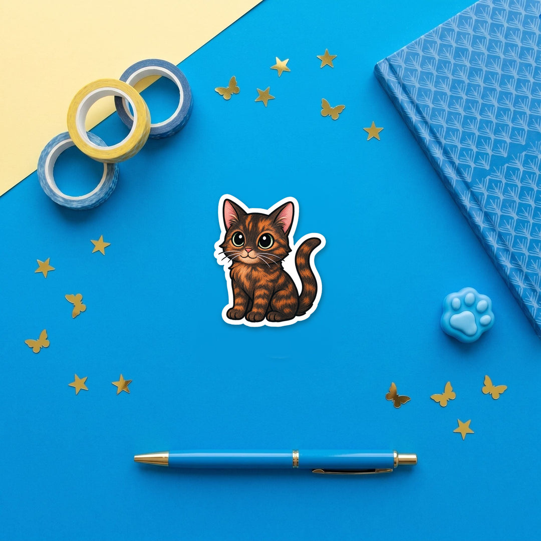 Chocolate Tortoiseshell Cat kawaii 3 inch fridge magnet flat lay with blue stationery