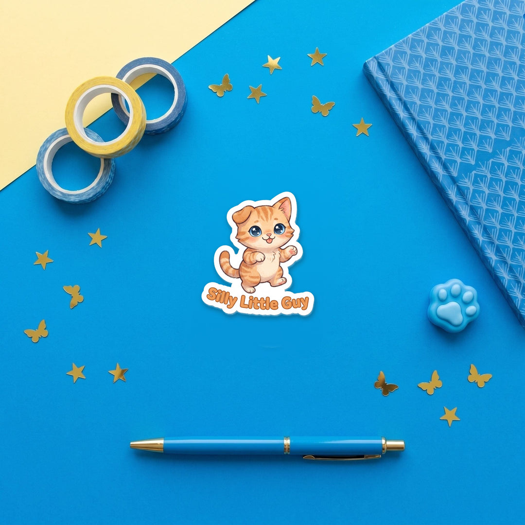 Silly Little Guy 3 inch fridge magnet flat lay with blue stationery