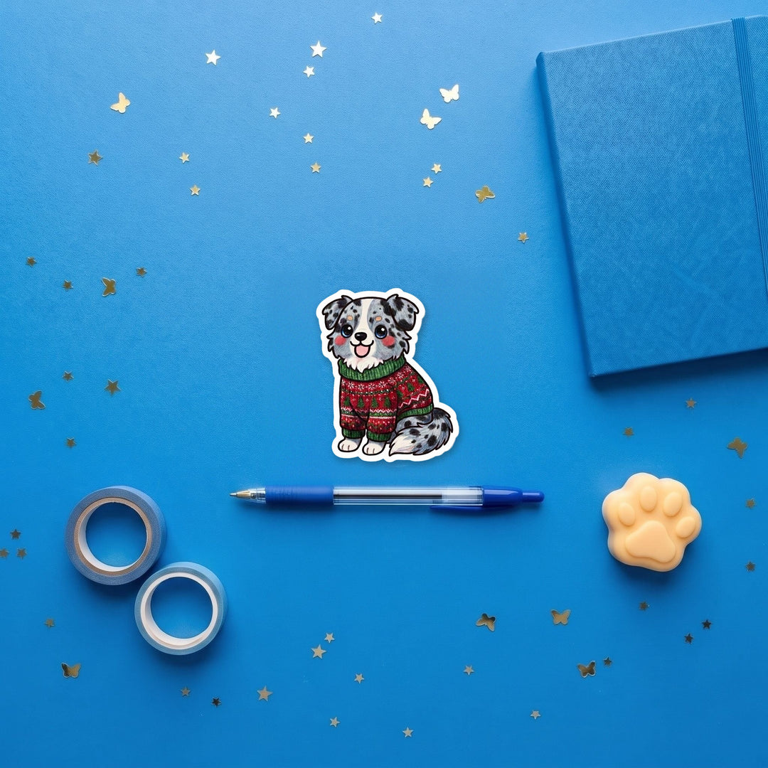 Australian Shepherd Blue Merle Ugly Sweater kawaii 3 inch fridge magnet flat lay with blue stationery