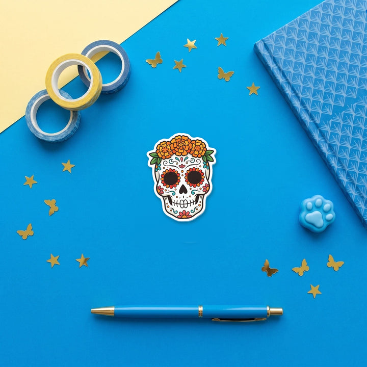 Sugar Skull 3 inch fridge magnet flat lay with blue stationery