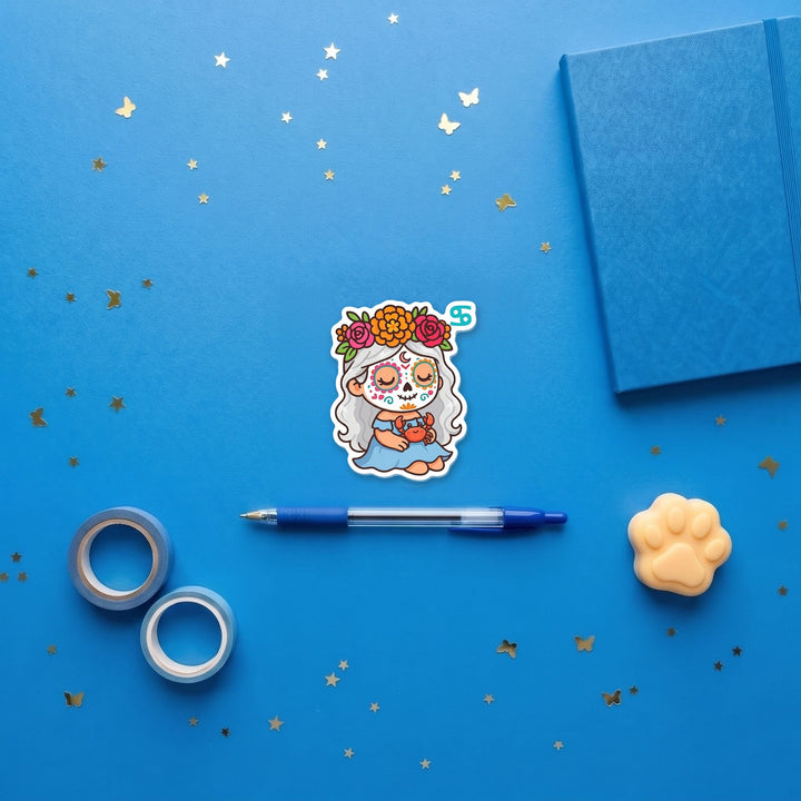 Cancer Sugar Skull Girl 3 inch fridge magnet flat lay with blue stationery