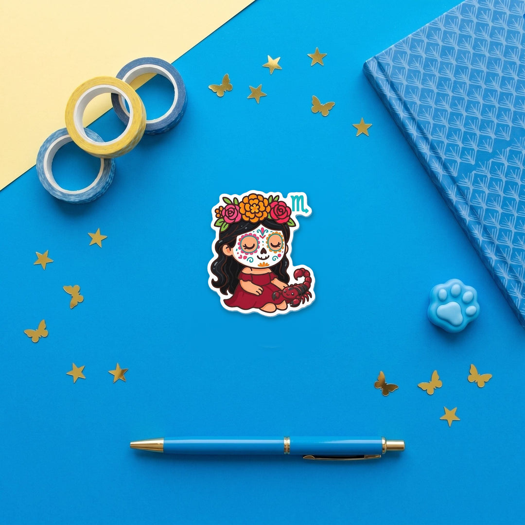 Scorpio Sugar Skull Girl 3 inch fridge magnet flat lay with blue stationery