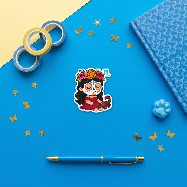 Scorpio Sugar Skull Girl 3 inch fridge magnet flat lay with blue stationery