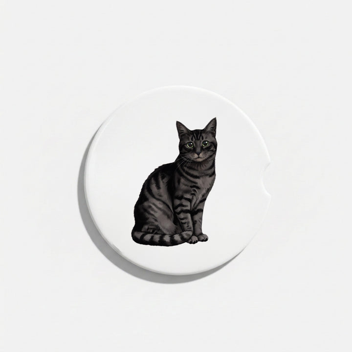 Single round ceramic car coaster featuring a watercolor-style illustration of an American Shorthair cat with a black tabby coat, sold individually.