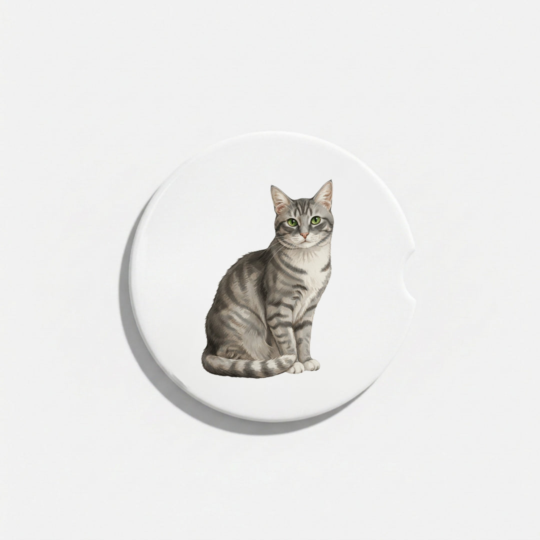 Single round ceramic car coaster featuring a watercolor-style illustration of an American Shorthair cat with a gray tabby coat, sold individually.