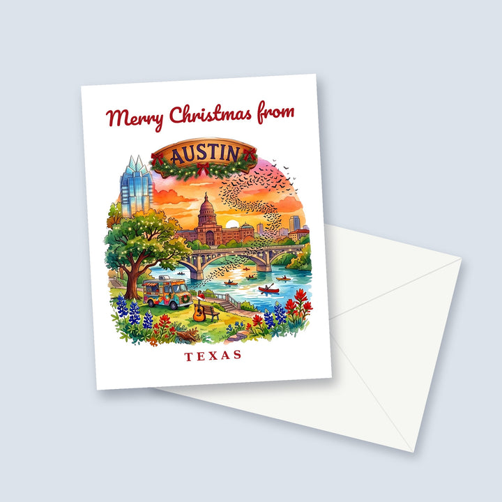 Merry Christmas from Austin Texas watercolor Christmas card with the Capitol, bats and bluebonnets, a garland-trimmed town sign and a white envelope