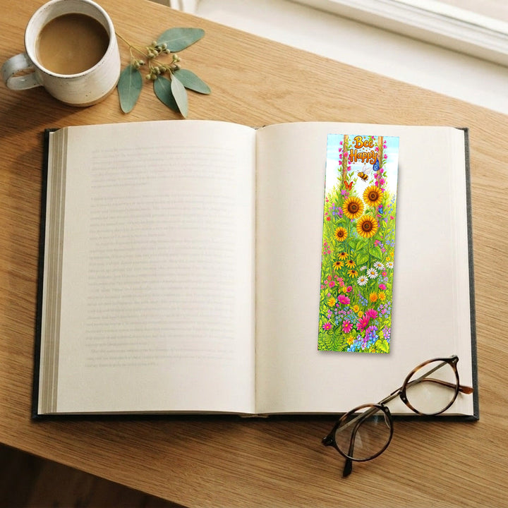 Bee Happy bookmark on an open book with coffee and glasses - Designs by Mysh