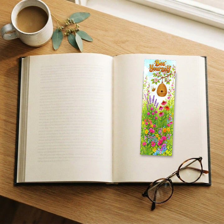 Bee Yourself bookmark on an open book with coffee and glasses - Designs by Mysh