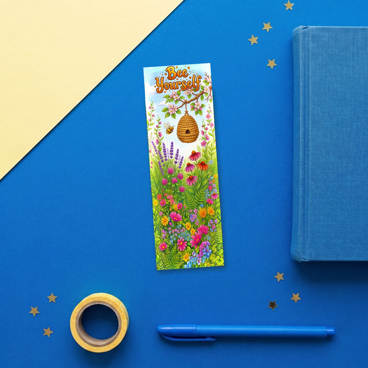 Bee Yourself 2x6 inch bookmark flat lay with blue book and stationery - Designs by Mysh