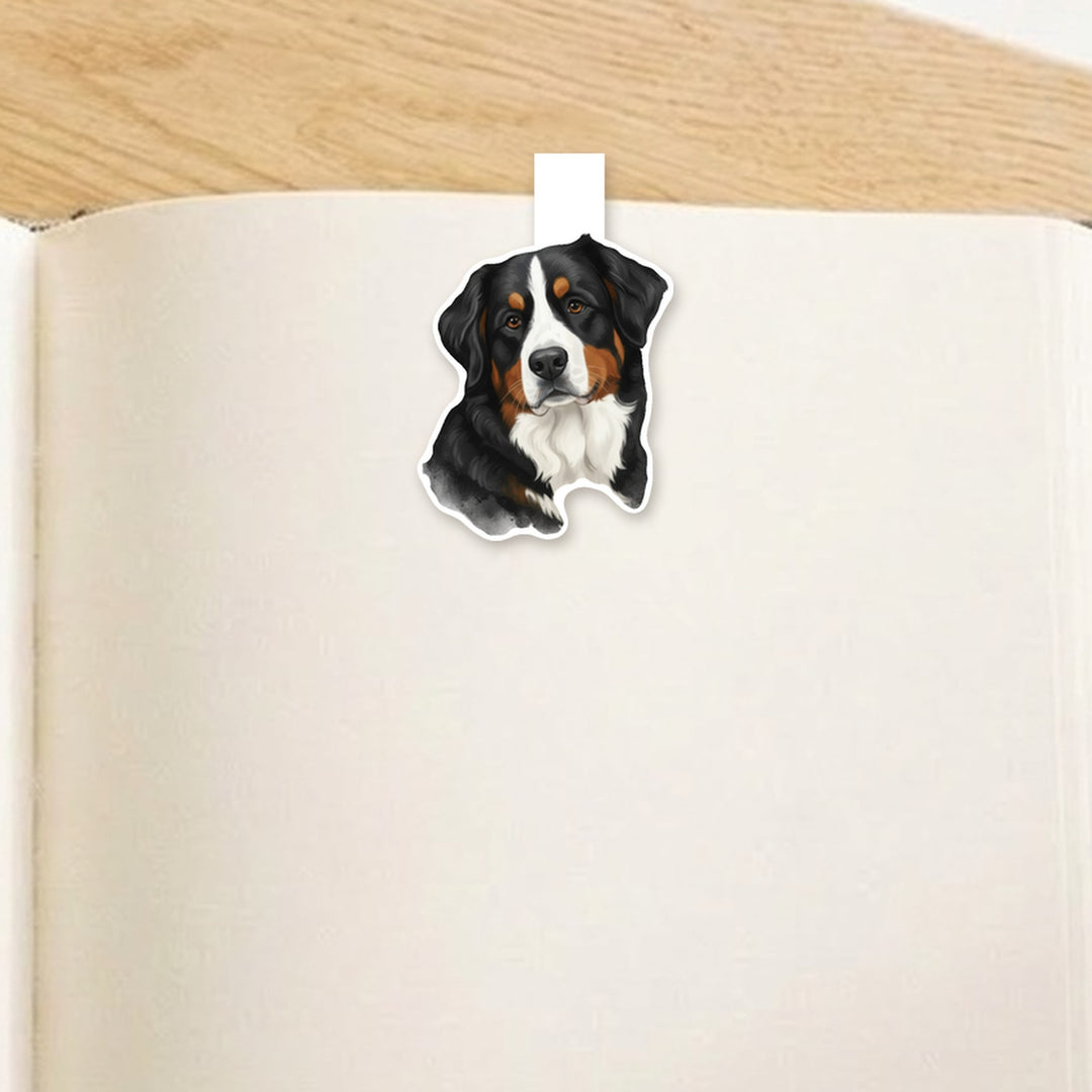 Bernese Mountain Dog watercolor magnetic bookmark clipped over the top of an open book page – Designs by Mysh