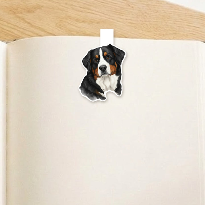 Bernese Mountain Dog watercolor magnetic bookmark clipped over the top of an open book page – Designs by Mysh