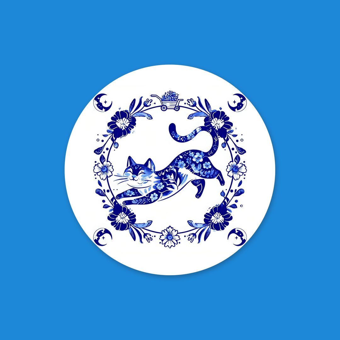Blue floral cat round vinyl sticker with a leaping Delft-style cat in a flower wreath – Designs by Mysh