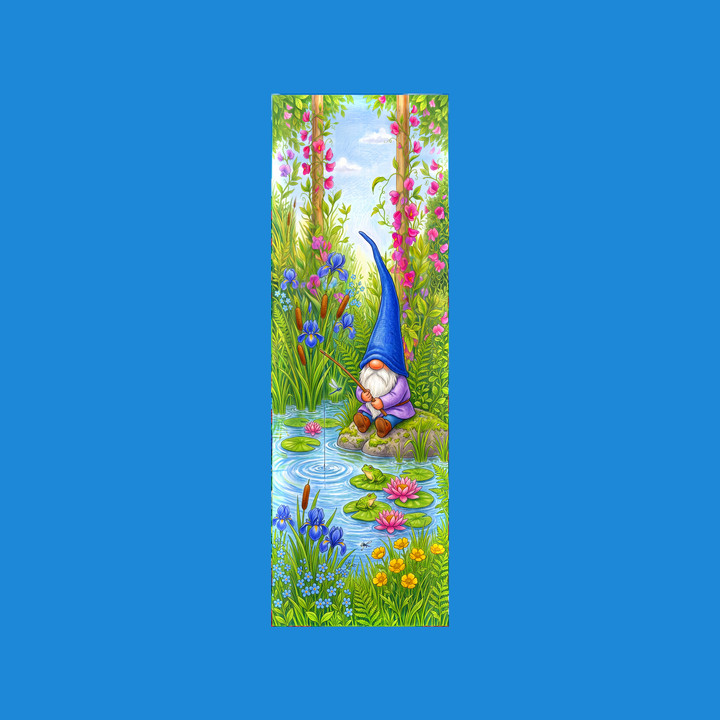 Blue gnome 2x6 bookmark: garden gnome in a tall blue hat fishing from a mossy rock by a pond with frogs on lily pads, water lilies, irises and cattails - colored-pencil storybook art by Designs by Mysh