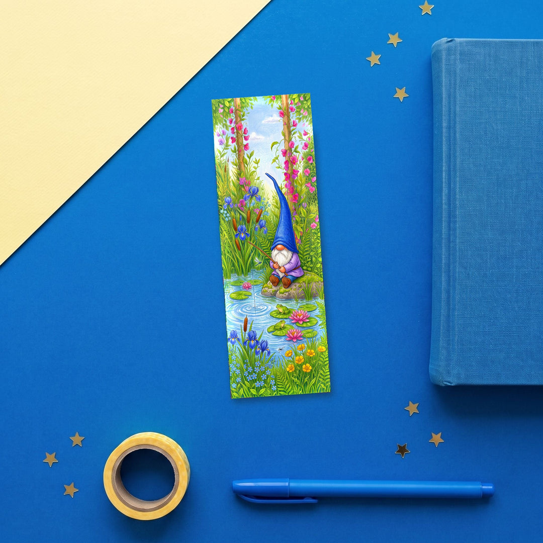 Blue Gnome Fishing Pond 2x6 inch bookmark flat lay with blue book and stationery - Designs by Mysh