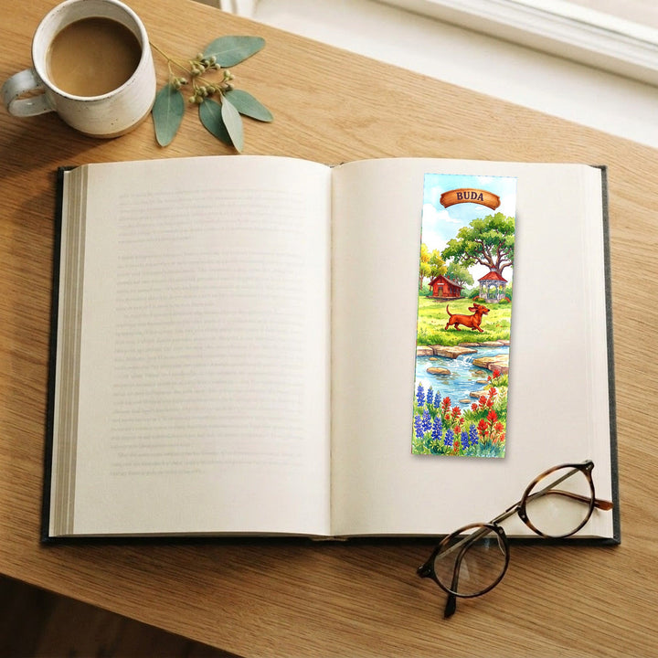 Buda Texas watercolor traditional bookmark on an open book with coffee and glasses - Designs by Mysh