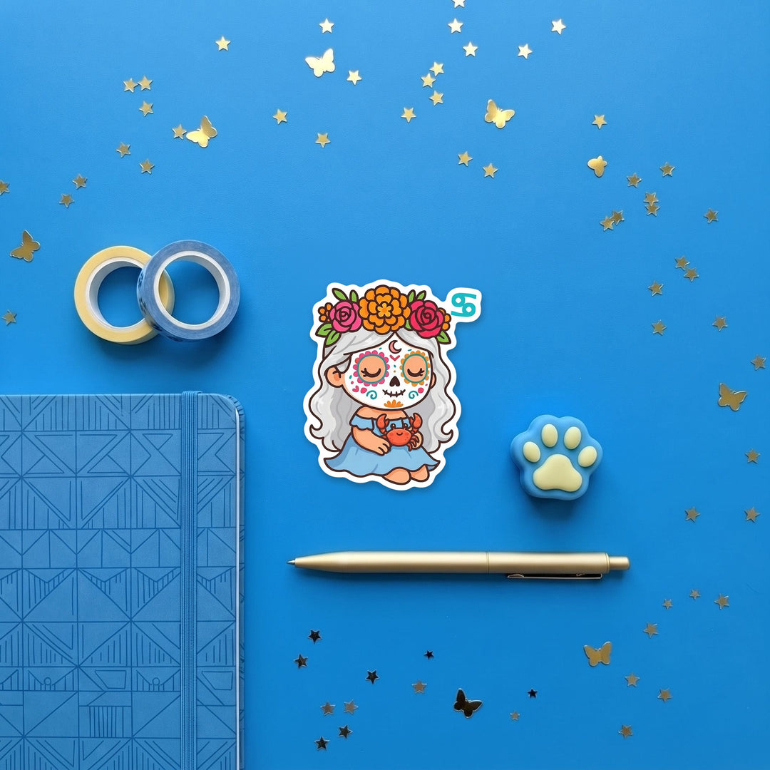 Cancer zodiac sugar skull girl 3 inch sticker flat lay with blue and yellow stationery – Designs by Mysh