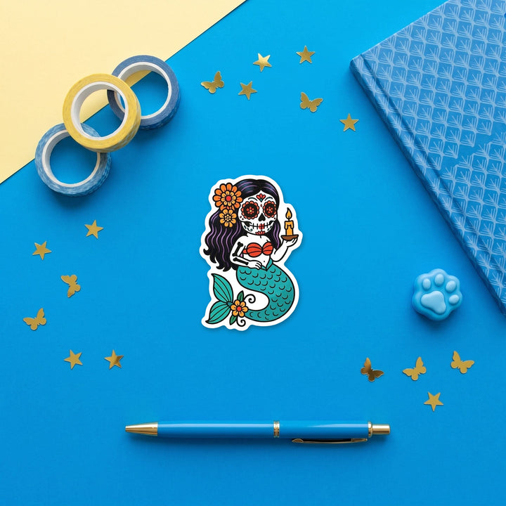 Candle sugar skull mermaid 3 inch sticker flat lay with blue stationery – Designs by Mysh