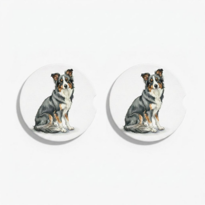 Set of two round ceramic car coasters featuring a watercolor-style illustration of a Border Collie with a blue tri-color coat.