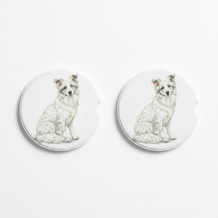 Set of two round ceramic car coasters featuring a watercolor-style illustration of a Border Collie with a white coat with ticking.