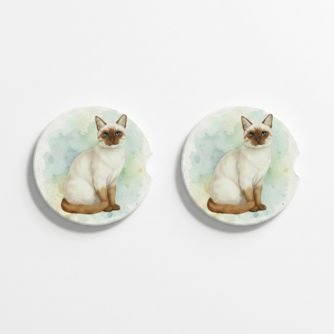 Set of two round ceramic car coasters featuring a watercolor-style illustration of a Siamese cat with a color point coat.