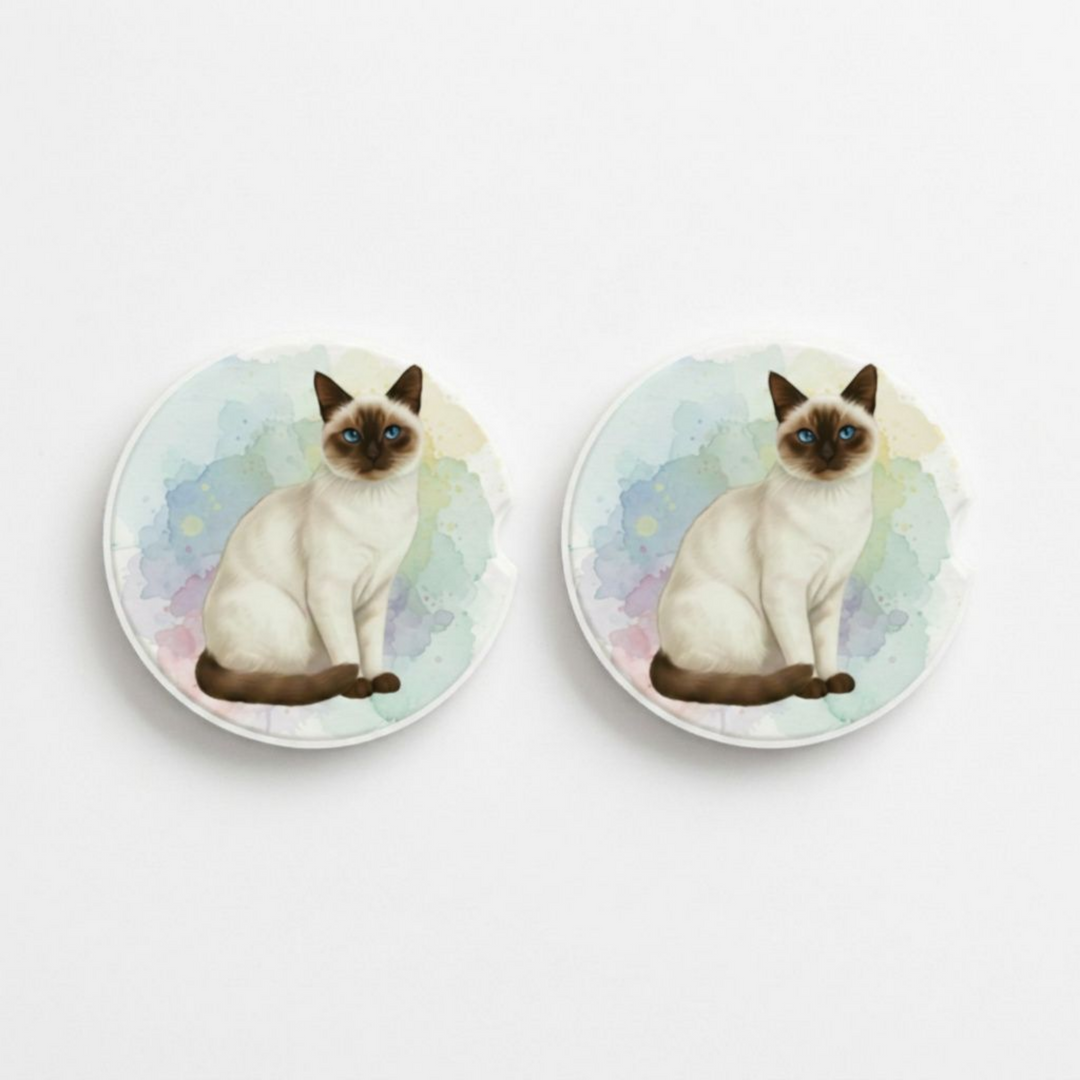 Set of two round ceramic car coasters featuring a watercolor-style illustration of a Siamese cat with a seal point coat.