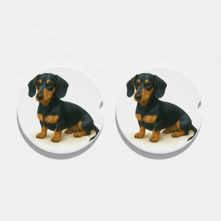 Pair of blue and tan dachshund dog figurines on a white background