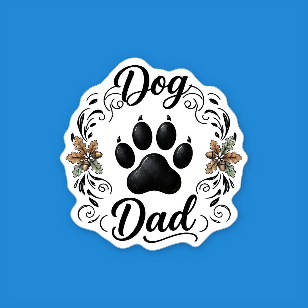 Dog Dad flexible fridge magnet with a black dog paw print, script lettering, oak leaves and acorns – Designs by Mysh