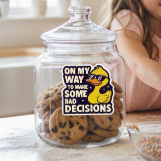 Man and two children in a kitchen baking cookies