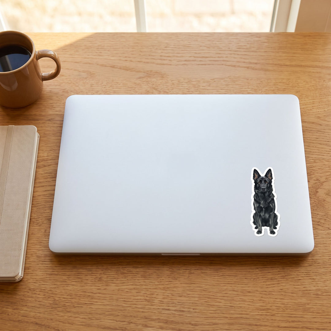 Black German Shepherd watercolor vinyl sticker on a laptop lid – Designs by Mysh