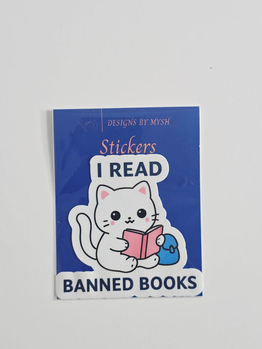 "Vinyl sticker featuring a white cartoon cat reading a pink book with the phrase 'I Read Banned Books' in bold text, 3-inch waterproof die-cut sticker."