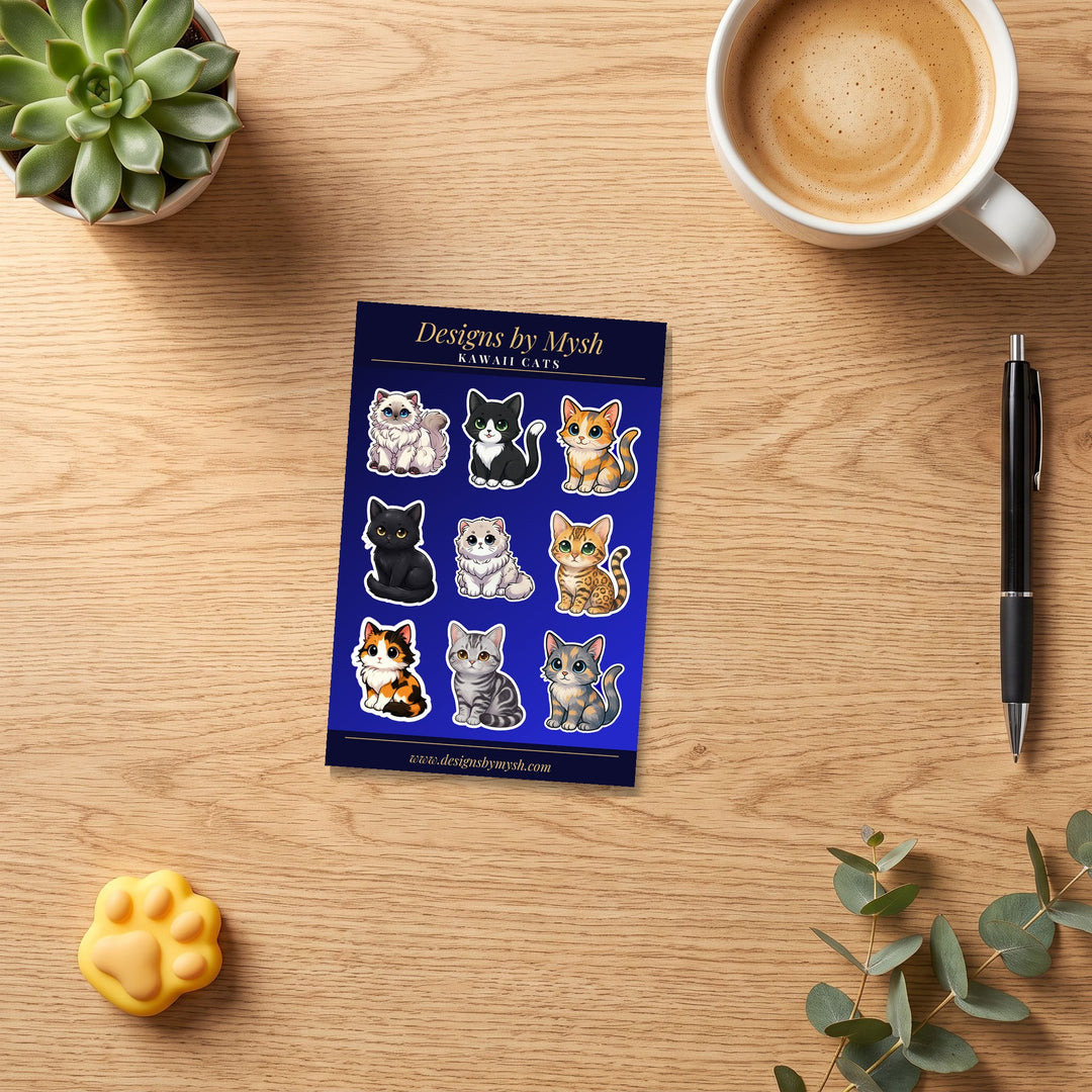 Kawaii Cats sticker sheet on a wooden desk with coffee and a pen – Designs by Mysh