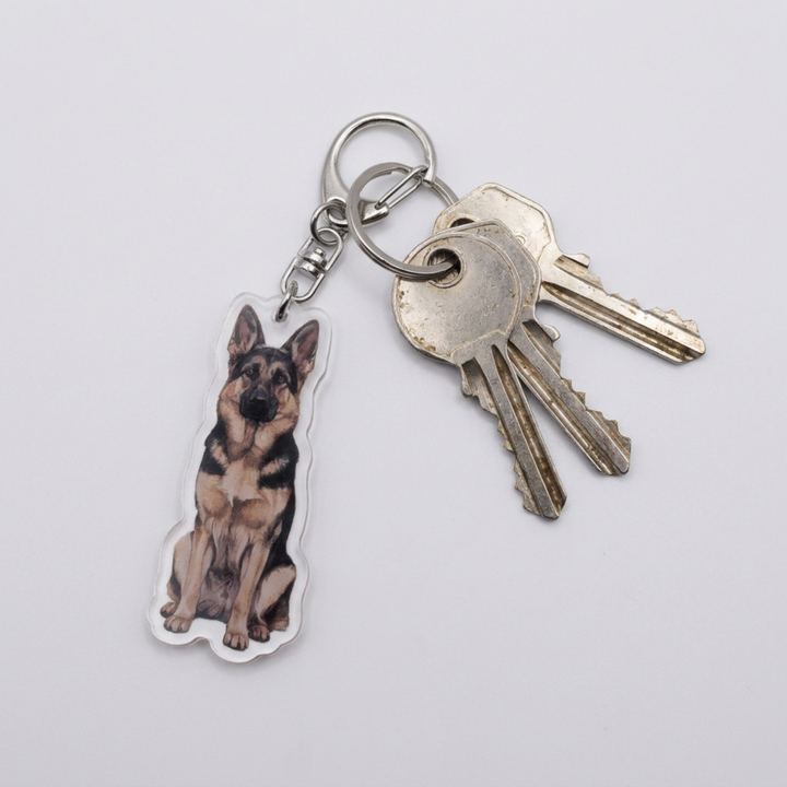 Sable German Shepherd acrylic keychain attached to a keyring with house keys