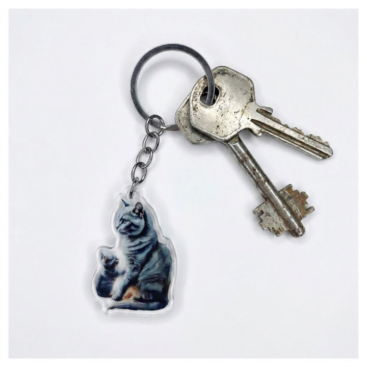 Russian Blue cat and kitten acrylic keychain attached to a keyring with house keys