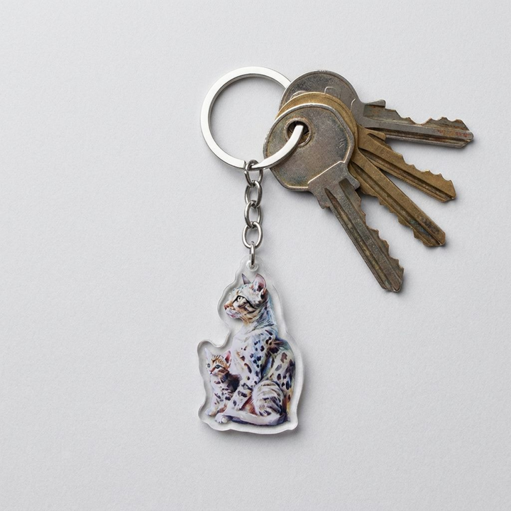 Spotted Egyptian Mau cat and kitten acrylic keychain attached to a keyring with house keys