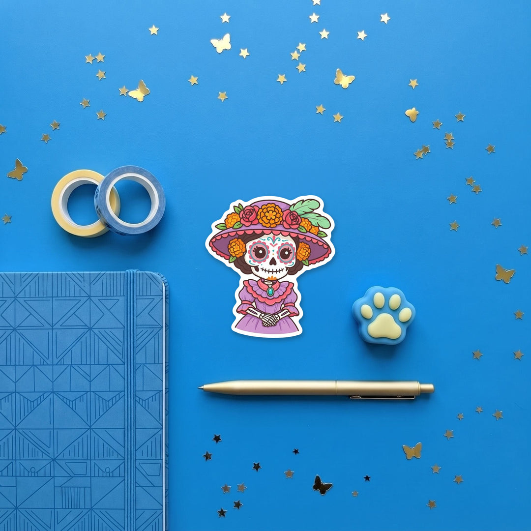 La Catrina 3 inch sticker flat lay with blue and yellow stationery – Designs by Mysh
