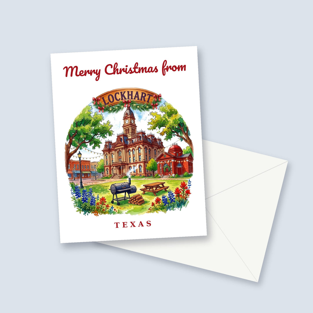 Merry Christmas from Lockhart Texas watercolor Christmas card with the courthouse, a BBQ smoker and bluebonnets, a garland-trimmed town sign and a white envelope