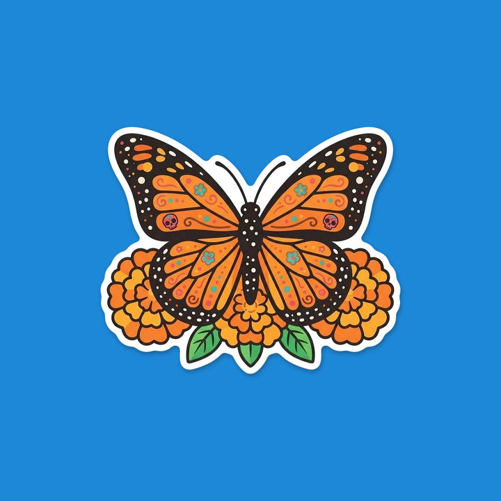 Monarch butterfly with sugar skull wing details resting on marigolds Día de los Muertos vinyl sticker – Designs by Mysh