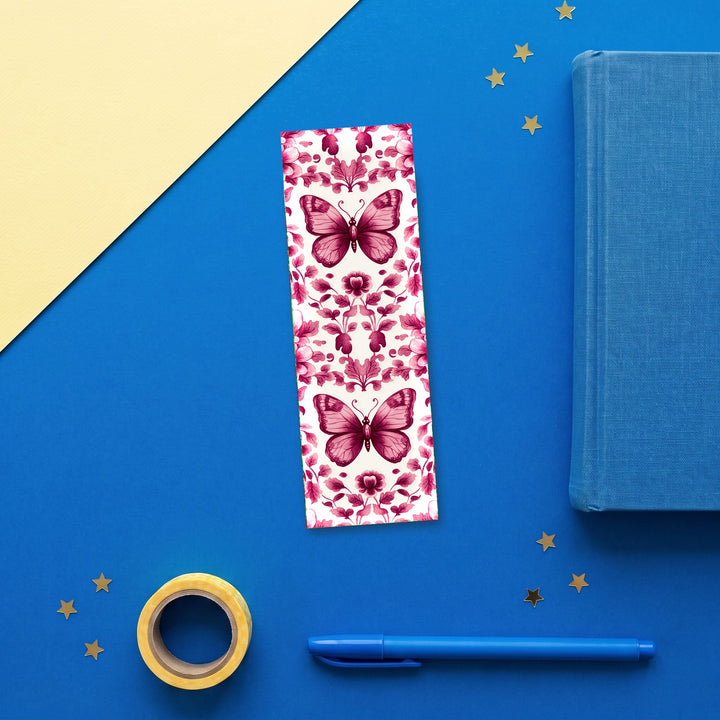 Pink Butterfly Chinoiserie 2x6 inch bookmark flat lay with blue book and stationery - Designs by Mysh