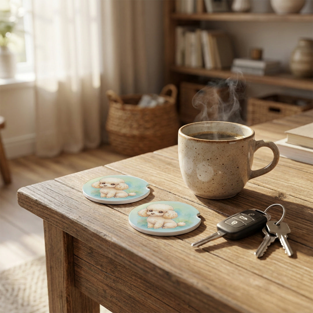Poodle car coasters with a cream coat styled on a wooden side table beside a steaming coffee mug and a set of keys.