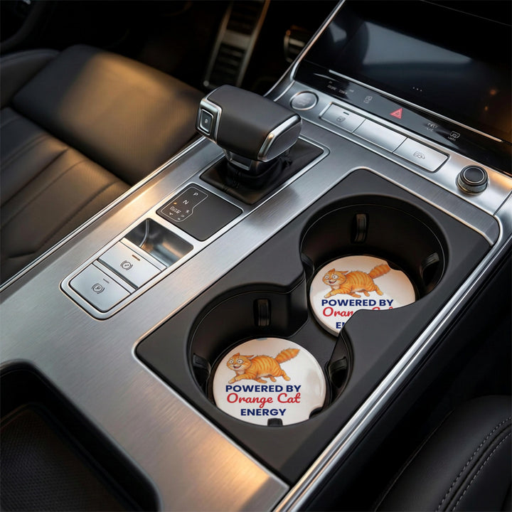 Powered By Orange Cat Energy car coasters in a car cup holder