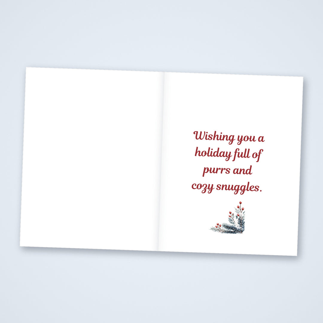 Inside of the Meowy Christmas card reading Wishing you a holiday full of purrs and cozy snuggles, with a blank left side for a note