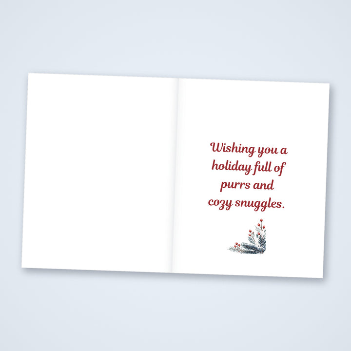 Inside of the Meowy Christmas card reading Wishing you a holiday full of purrs and cozy snuggles, with a blank left side for a note