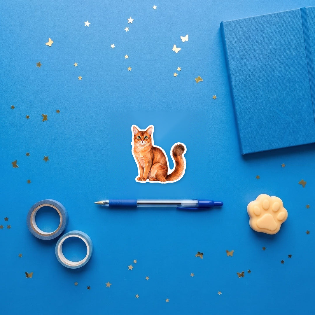 Somali Cinnamon watercolor sticker flat lay with stationery – Designs by Mysh