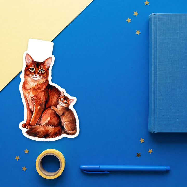 Somali cat and kitten magnetic bookmark flat lay with blue and yellow stationery – Designs by Mysh