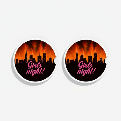 Set of two ceramic car coasters with a black city skyline and flames, featuring the text “Girls Night!” in pink script and a side notch for easy removal.