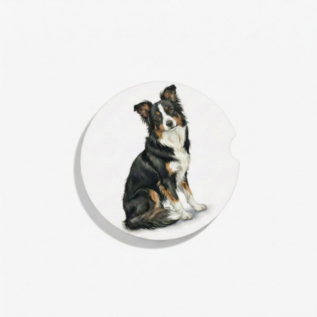 Single round ceramic car coaster featuring a watercolor-style illustration of a Border Collie with a black tri-color coat, sold individually.