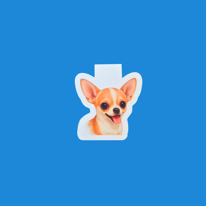 A die-cut sticker featuring a Chihuahua dog portrait, shown against a solid blue background.